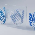 SynthID Bio: Google DeepMind Brings Invisible Watermarks to AI-Designed Proteins Blue AI-designed protein structures in a row, with a frosted glass panel revealing a hidden dotted watermark pattern across one protein.
